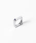 Silver edge ring with sparkling gemstones from MAISON MEGH jewelry collection, showcasing intricate design and gem accents.