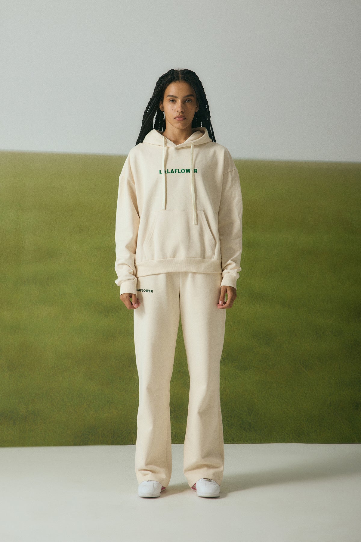 OFF-WHITE SWEATPANTS WITH GREEN EMBROIDERY