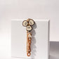 CREME FLOWER BROWN SHORT PHONE STRAP