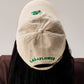 CREAM BASEBALL CAP WITH GREEN EMBROIDERY