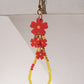 FLORA RED 
SHORT CRYSTAL PHONE STRAP