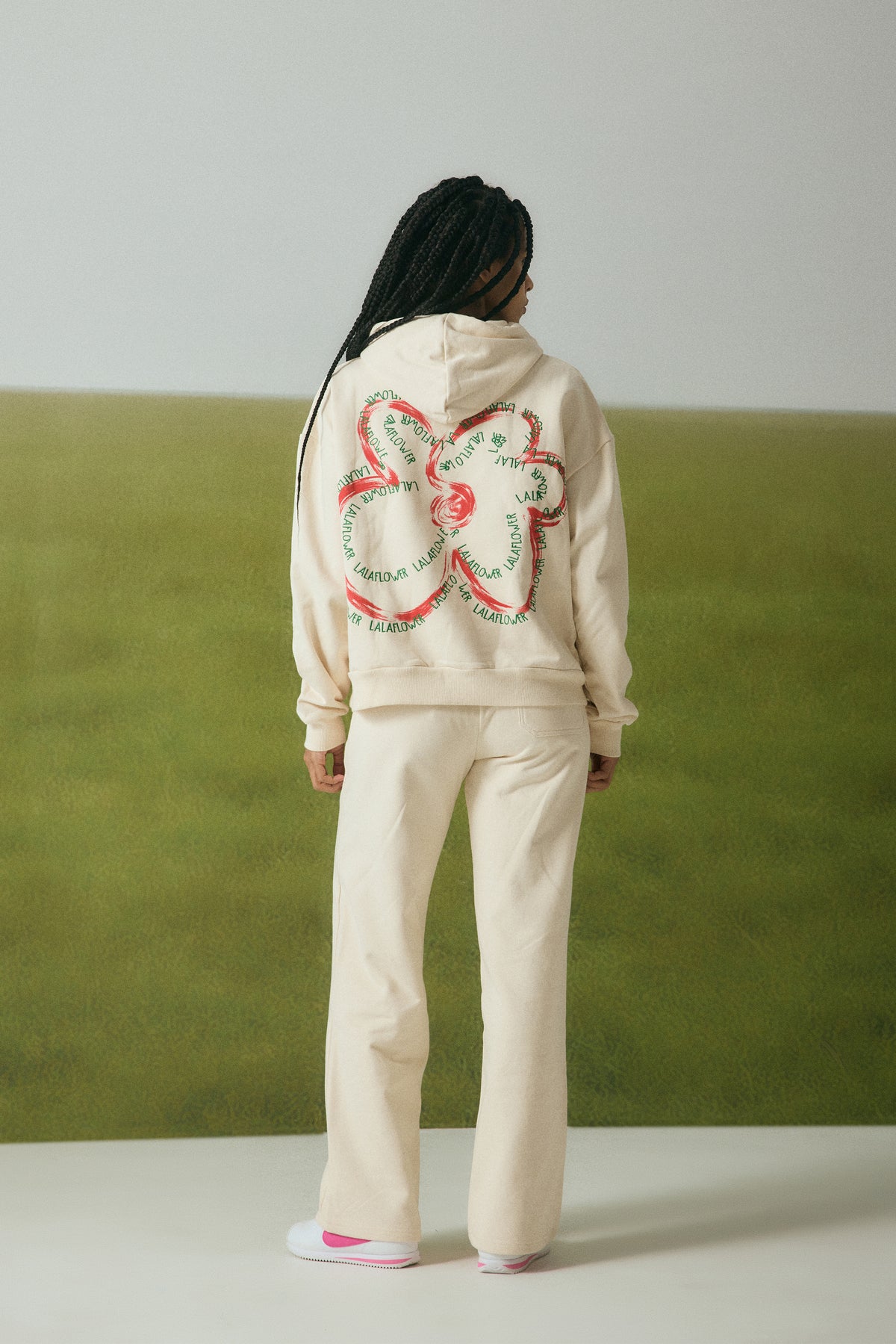OFF-WHITE SWEATPANTS WITH GREEN EMBROIDERY