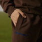 COFFEE SWEATPANTS WITH BLUE EMBROIDERY