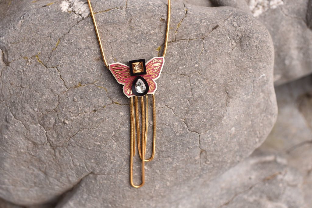 THE BUTTERFLY NECKLACE IN MAJENTA