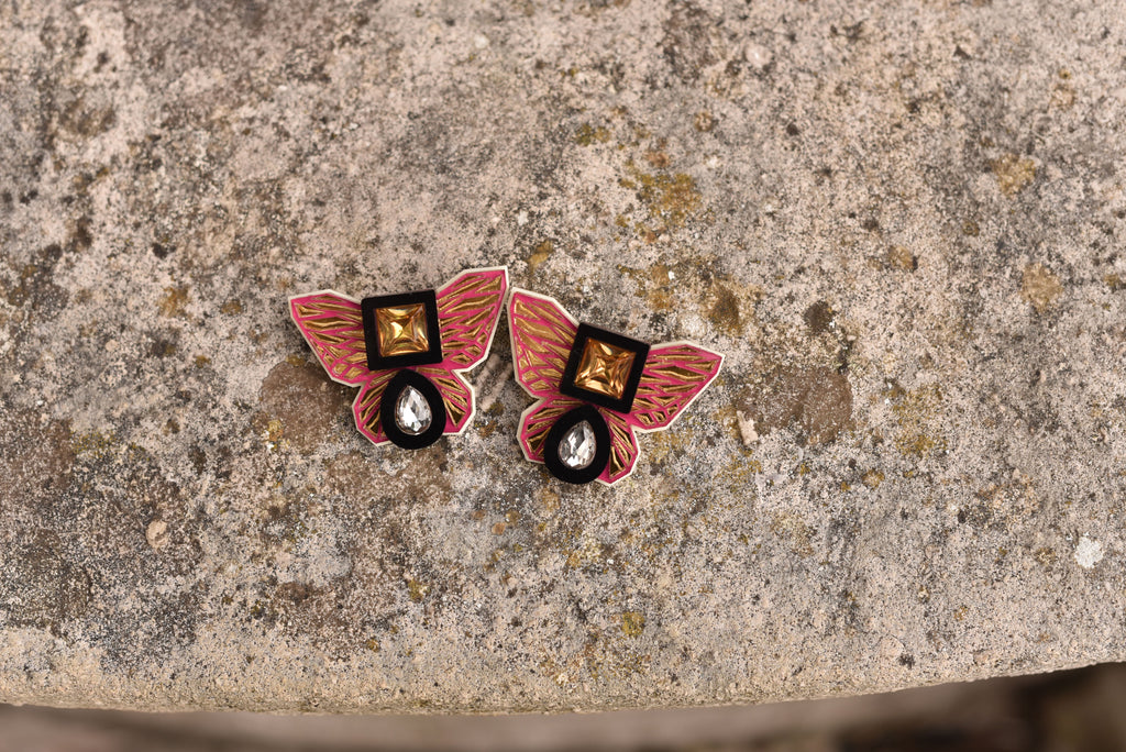 BUTTERFLY STUDS IN MAJENTA