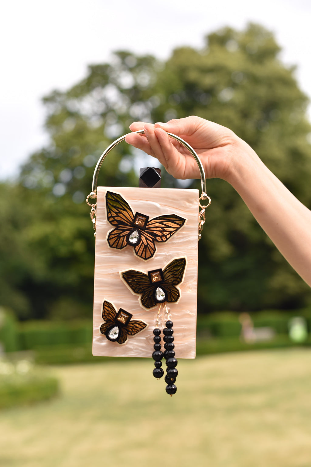 THE CREME BUTTERFLY MOBILE BAG