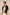 Man wearing a black floral shirt with a beige background Calling June