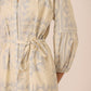 Beige dress with blue pattern on a beige background Calling June