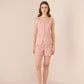 Woman wearing a pink outfit on a beige background Calling June