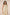Woman wearing a floral halter neck dress against a plain background Calling June