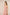 Woman wearing a pink strapless dress against a beige background Calling June