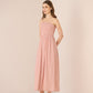 Woman wearing a strapless pink dress against a beige background Calling June