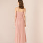 Woman wearing a pink strapless dress against a plain background Calling June