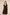 Black dress with gold trim worn by a model on a beige background Calling June