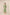 Woman wearing a green embroidered dress against a beige background Calling June