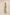 Woman wearing a green embroidered dress on a beige background Calling June