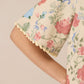 Floral-patterned shorts with a beige background Calling June