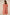 Woman wearing a pink dress with lace details on a beige background Calling June
