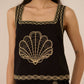 Black sleeveless top with gold embroidery on a plain background Calling June