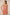 Woman wearing a pink dress with shell design on a beige background Calling June