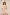 Woman wearing a pink and white dress with shell pattern on a beige background Calling June
