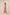 Woman wearing a pink floral dress against a plain background Calling June