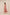 Woman wearing a pink strapless dress with white floral pattern on a beige background Calling June