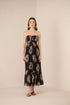 Woman wearing a strapless dress with floral pattern on a beige background Calling June