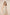 Woman wearing a floral dress and shorts on a beige background Calling June
