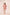 Woman wearing a pink dress with white lace details on a plain background Calling June