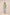 Woman wearing a green embroidered top and light blue jeans on a beige background Calling June