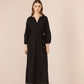 Woman wearing a black dress on a beige background Calling June