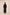 Woman wearing a black dress with long sleeves and a belt, standing against a plain background. Calling June