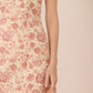 Floral dress with pink roses on a beige background Calling June