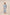 Woman wearing a light blue embroidered outfit on a beige background Calling June