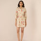 Woman wearing a floral dress on a beige background Calling June