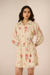 Woman wearing a floral dress with a beige background Calling June