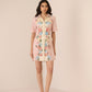 Woman wearing a floral dress on a beige background Calling June