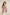 Woman wearing a pink floral top against a beige background Calling June