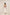 Woman wearing a patterned top and white pants on a beige background Calling June