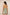 Woman wearing a green patterned romper with thin straps on a beige background Calling June