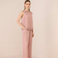 Woman wearing a pink textured outfit on a beige background Calling June