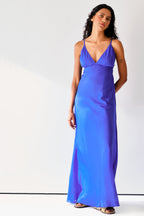 Made from lightweight silk-cotton, the Rhea slip has slim, adjustable straps and V shaped neckline. The dress cut on bias gently skims your frame before falling to a floor-length hem.